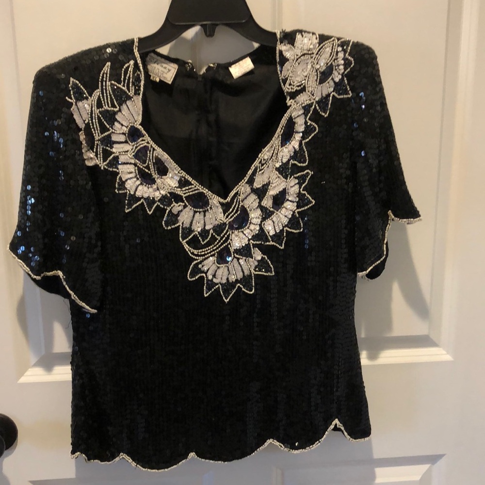 Sequin top black with white beading. Size XL